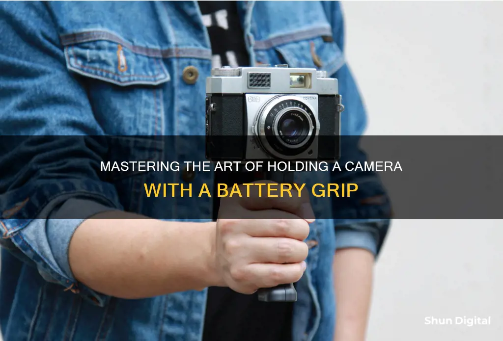 how to hold a camera with a battery grip