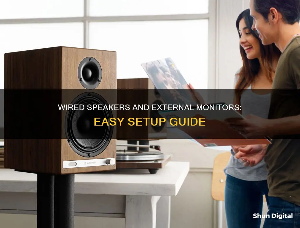 how to hook up wired speakers to external monitor