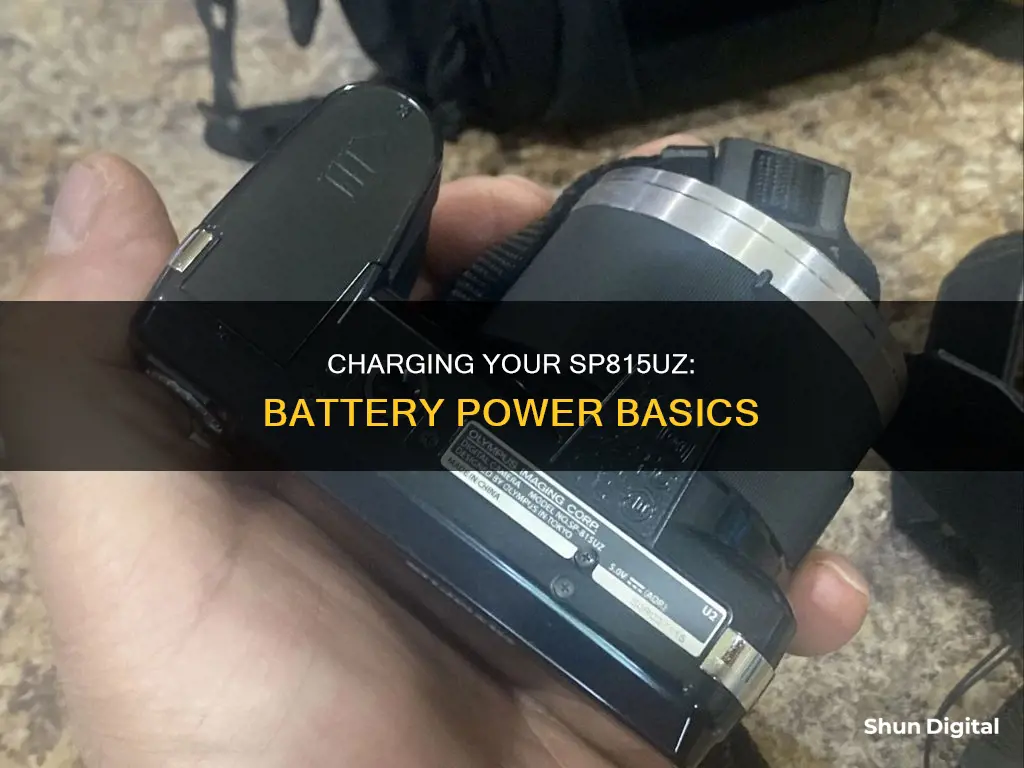 where to charge battery on sp815uz olympus camera